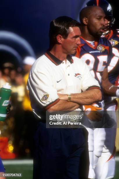 Head Coach Mike Shanahan of the Denver Broncos follows the action in the Super Bowl XXXII game between the Green Bay Packers v the Denver Broncos on...