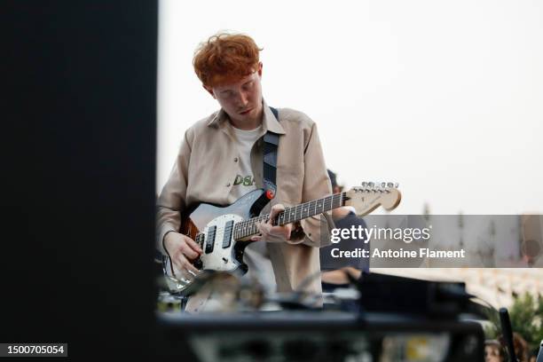 King Krule performs on stage at the OTW By Vans Party at Pont Alexandre III during Paris Fashion Week on June 22, 2023 in Paris, France.