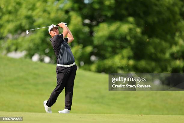 Sungjae Im of Korea plays his third shot on the 14th hole during the first round of the Travelers Championship at TPC River Highlands on June 22,...