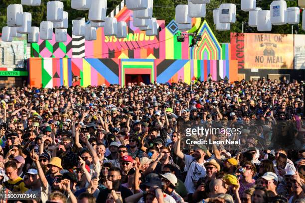 Festival-goers listen to Mike Skinner perform on Day 2 of Glastonbury Festival 2023 on June 22, 2023 in Glastonbury, England.