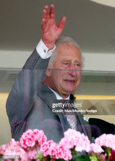 Visibly emotional King Charles III waves from the Royal Box after his horse 'Desert Hero' won 'The King George V Stakes' on day 3 'Ladies Day' of...