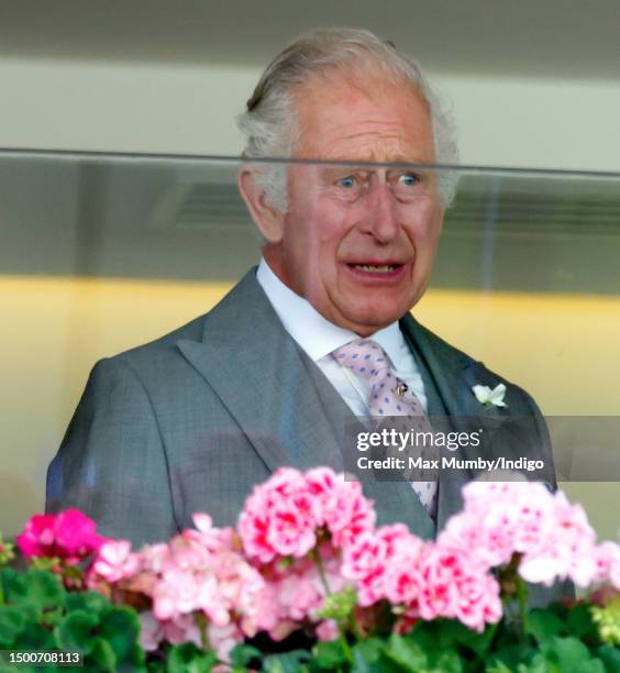 Visibly emotional King Charles III watches from the Royal Box after his horse 'Desert Hero' won 'The King George V Stakes' on day 3 'Ladies Day' of...