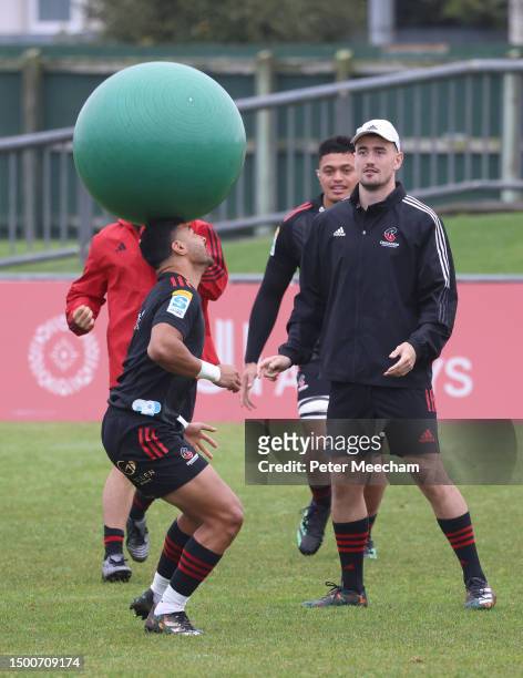 Richie Mo'unga of the crusaders heads a Swiss ball as Will Jordan of the Crusaders looks on at right, during a Crusaders Super Rugby captain's run at...