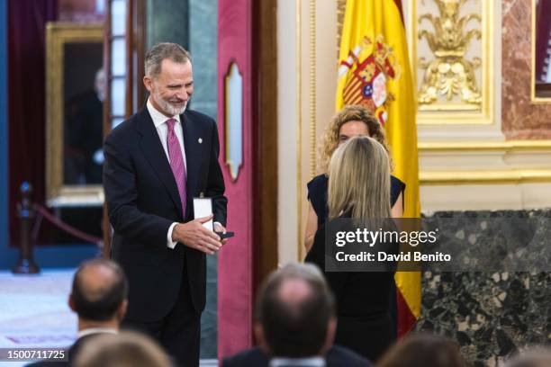 King Felipe VI of Spain, Guadalupe Hernandez Gil and Meritxell Batet attend the delivery of the 'Medallas del Congreso' by King Felipe VI of Spain to...