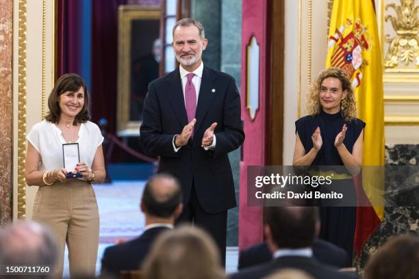 Celia Pons, King Felipe VI of Spain and Meritxell Batet attend the delivery of the 'Medallas del Congreso' by King Felipe VI of Spain to the former...