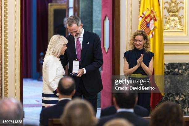 Carmen Ortiz, King Felipe VI of Spain and Meritxell Batet attend the delivery of the 'Medallas del Congreso' by King Felipe VI of Spain to the former...