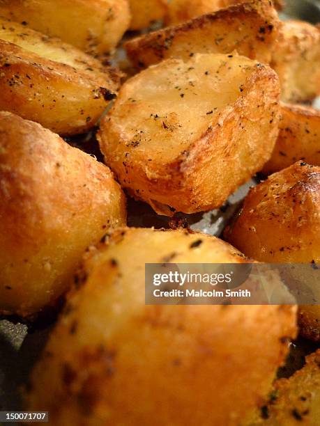 roast potatoes - roast potatoes stock pictures, royalty-free photos & images