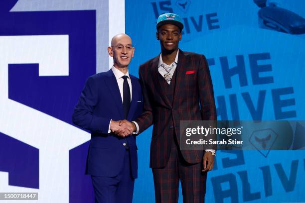 Brandon Miller poses with NBA commissioner Adam Silver after being drafted second overall pick by the Charlotte Hornets during the first round of the...