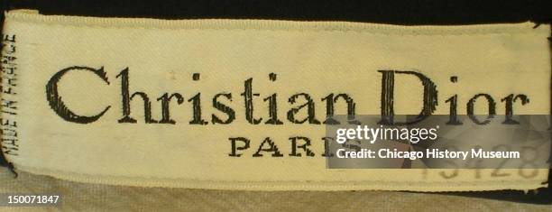 Designer label inside skirt, 1951. Wool by Christian Dior. From Dior's 1949 'New Look' collection.