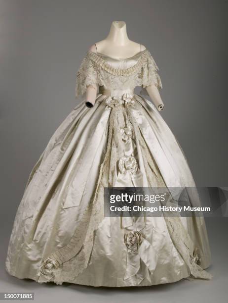 Evening dress, 1861 . Silk satin, silk ribbon, hand-made point de gaze lace, attributed to Worth & Bobergh.