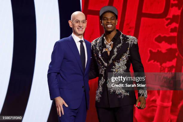 Scoot Henderson poses with NBA commissioner Adam Silver after being drafted third overall pick by the Portland Trail Blazers during the first round...