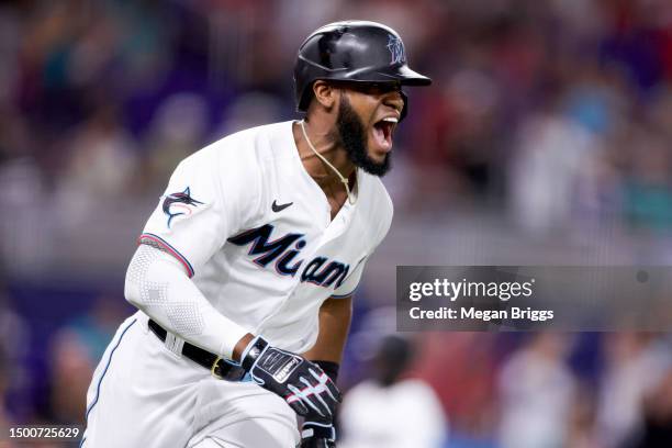 Bryan De La Cruz of the Miami Marlins reacts after hitting a RBI single against the Pittsburgh Pirates during the eighth inning at loanDepot park on...
