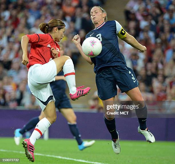 Defender Kelley O'Hara blocks a shot by Japan midfielder Nahomi Kawasumi in the first half of the Olympics women's soccer gold medal match at Wembley...