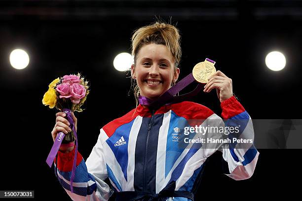 Gold medalist Jade Jones of Great Britain celebrates on the podium during the medal ceremony for the Women's -57kg Taekwondo on Day 13 of the London...