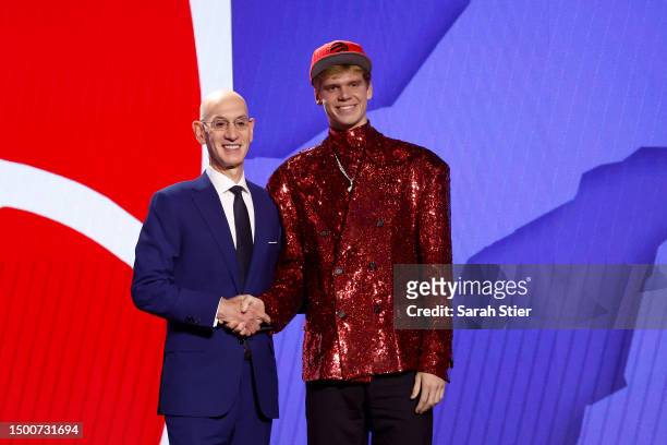 Gradey Dick poses with NBA commissioner Adam Silver after being drafted 13th overall pick by the Toronto Raptors during the first round of the 2023...
