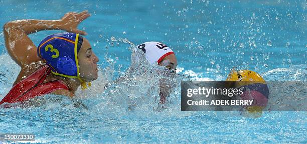 Player Jessica Steffens challenges Anni Espar Llaquet of Spain during the women's water polo final match at the London 2012 Olympic Games in London...