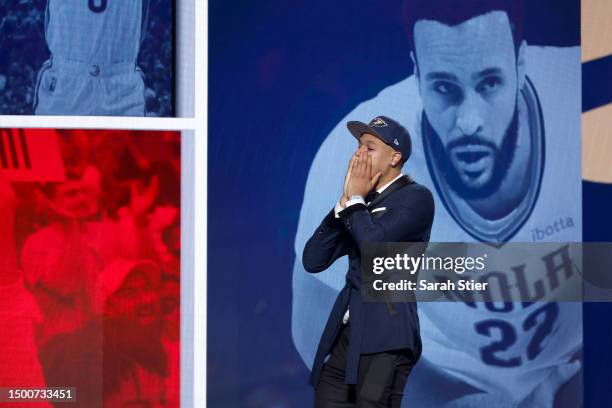 Jordan Hawkins celebrates after being drafted 14th overall pick by the New Orleans Pelicans during the first round of the 2023 NBA Draft at Barclays...