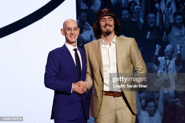 Jaime Jacquez Jr. Poses with NBA commissioner Adam Silver after being drafted 18th overall pick by the Miami Heat during the first round of the 2023...