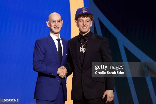 Brandin Podziemski poses with NBA commissioner Adam Silver after being drafted 19th overall pick by the Golden State Warriors during the first round...