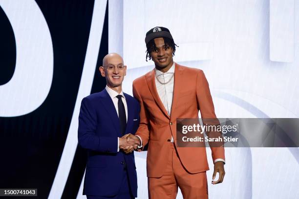 Noah Clowney poses with NBA commissioner Adam Silver after being drafted 21st overall pick by the Brooklyn Nets during the first round of the 2023...