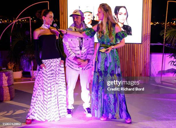 Lizzie Vaynerchuk, Gary Vaynerchuk and Tal Navarro speak during a fashion fundraiser and disco on the VX Yacht on June 22, 2023 in Cannes, France.
