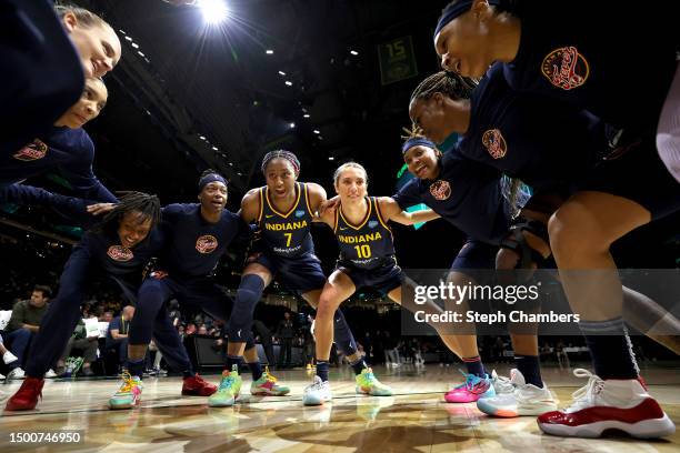 Aliyah Boston of the Indiana Fever and her teammates gather before the game against the Seattle Storm at Climate Pledge Arena on June 22, 2023 in...
