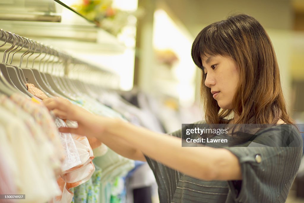 Woman choosing dresses