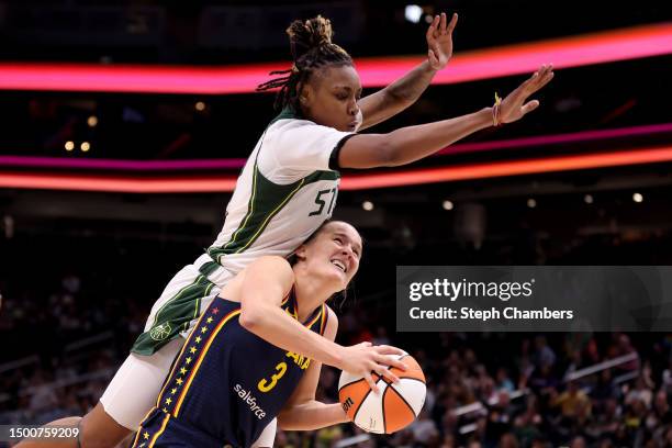 Jordan Horston of the Seattle Storm fouls Kristy Wallace of the Indiana Fever during the third quarter at Climate Pledge Arena on June 22, 2023 in...