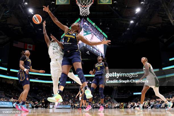 Aliyah Boston of the Indiana Fever blocks the shot of Jewell Loyd of the Seattle Storm during the fourth quarter at Climate Pledge Arena on June 22,...