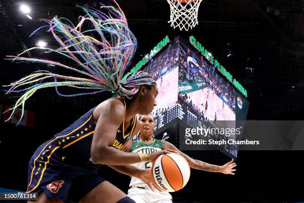Mercedes Russell of the Seattle Storm defends Aliyah Boston of the Indiana Fever during the first quarter at Climate Pledge Arena on June 22, 2023 in...