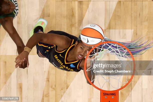 Ezi Magbegor of the Seattle Storm and Aliyah Boston of the Indiana Fever rebound during the second quarter at Climate Pledge Arena on June 22, 2023...
