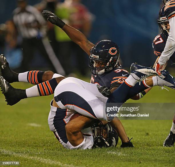 Nick Roach of the Chicago Bears brings down Eric Decker of the Denver Broncos during a preseason game at Soldier Field on August 9, 2012 in Chicago,...