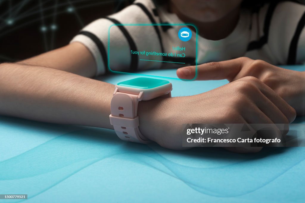 Caucasian girl receives notifications on smart swatch