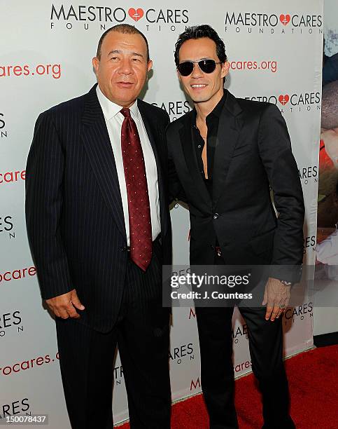 Entrepreneur Henry Cardenas and singer Marc Anthony attend the Maestro Cares Foundation Benefit at El Museo Del Barrio on August 9, 2012 in New York...