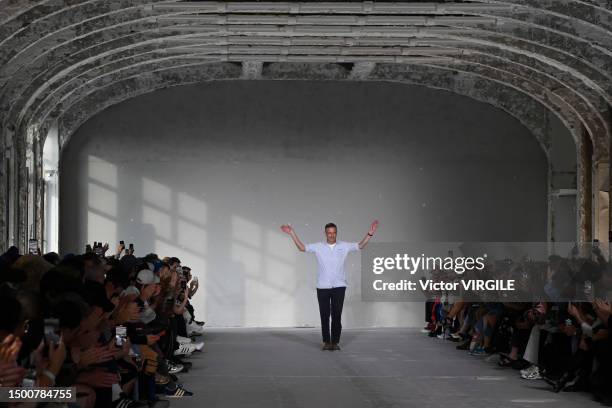 Fashion designer Dries Van Noten walks the runway during the Dries Van Noten Ready to Wear Spring/Summer 2024 fashion show as part of the Paris Men...