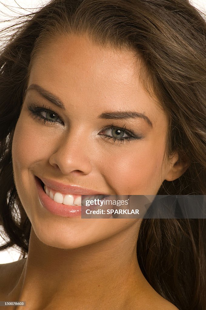 A young woman smiling to camera
