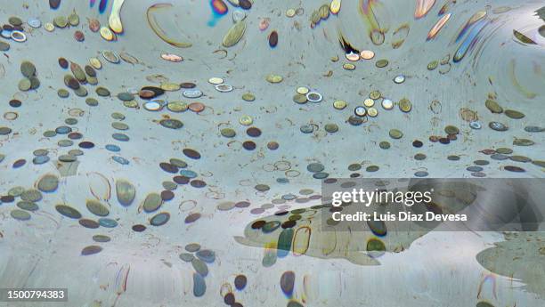 coins inside the trevi fountain - piazza di trevi stock pictures, royalty-free photos & images