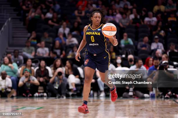 Kelsey Mitchell of the Indiana Fever dribbles against the Seattle Storm during the third quarter at Climate Pledge Arena on June 22, 2023 in Seattle,...