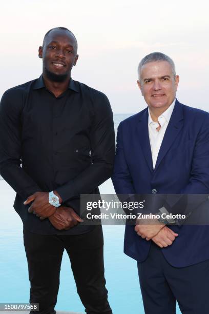 Usain Bolt and Hublot CEO, Ricardo Guadalupe attend the launch of the new Big Bang Unico Azur by Hublot at Hotel Cap-Estel on June 22, 2023 in Èze,...