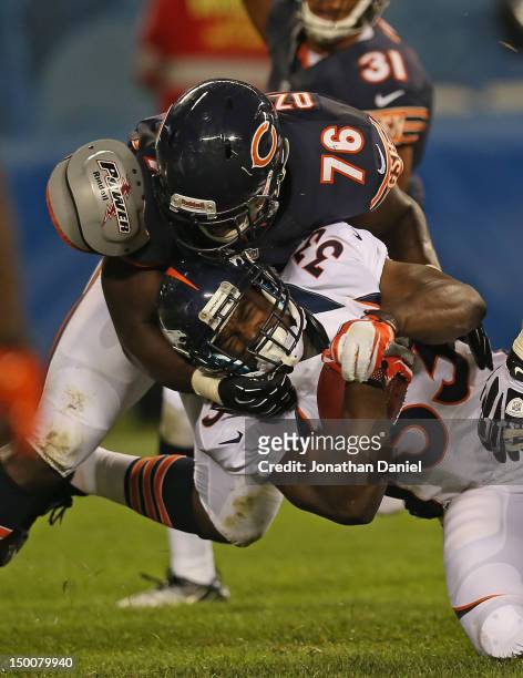 Cheta Ozougwu of the Chicago Bears tackles Xavier Omon of the Denver Broncos during a preseason game at Soldier Field on August 9, 2012 in Chicago,...
