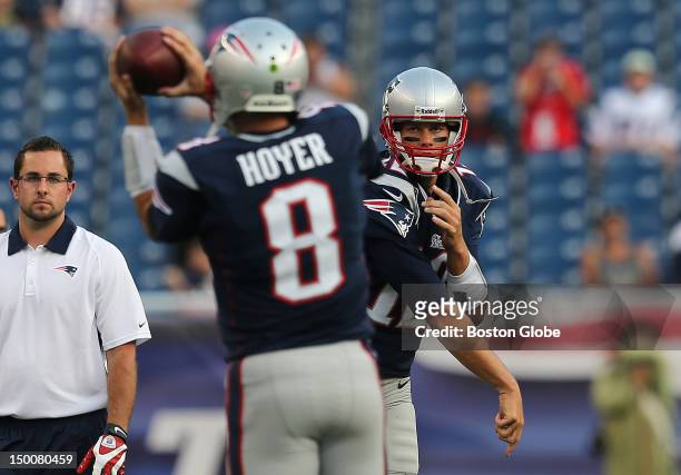 New England Patriots quarterback Tom Brady throws to New England Patriots quarterback Brian Hoyer during pre game warmup before a preseason...