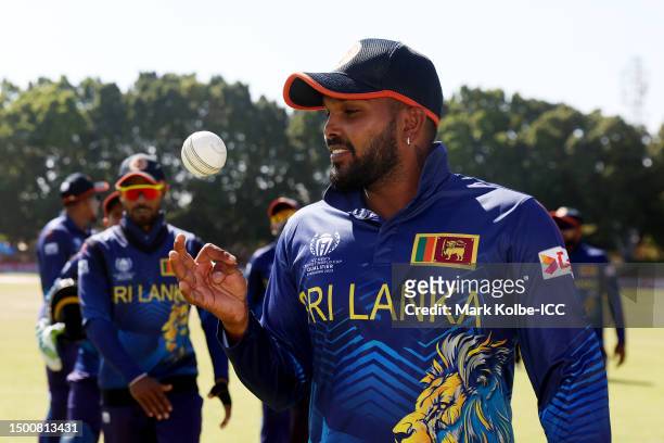 Wanindu Hasaranga of Sri Lanka poses for a photograph with the match ball after taking five wickets during the ICC Men´s Cricket World Cup Qualifier...