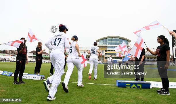 England take to the field ahead of day two of the LV= Insurance Women's Ashes Test match between England and Australia at Trent Bridge on June 23,...