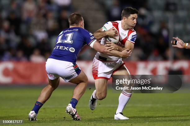 Ben Hunt of the Dragons is tackled by Jackson Ford of the Warriors during the round 17 NRL match between St George Illawarra Dragons and New Zealand...