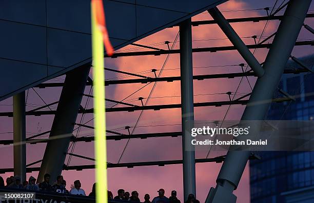 Fans of the Chicago Bears watch at sunset as the Bears take on the Denver Broncos during a preseason game at Soldier Field on August 9, 2012 in...