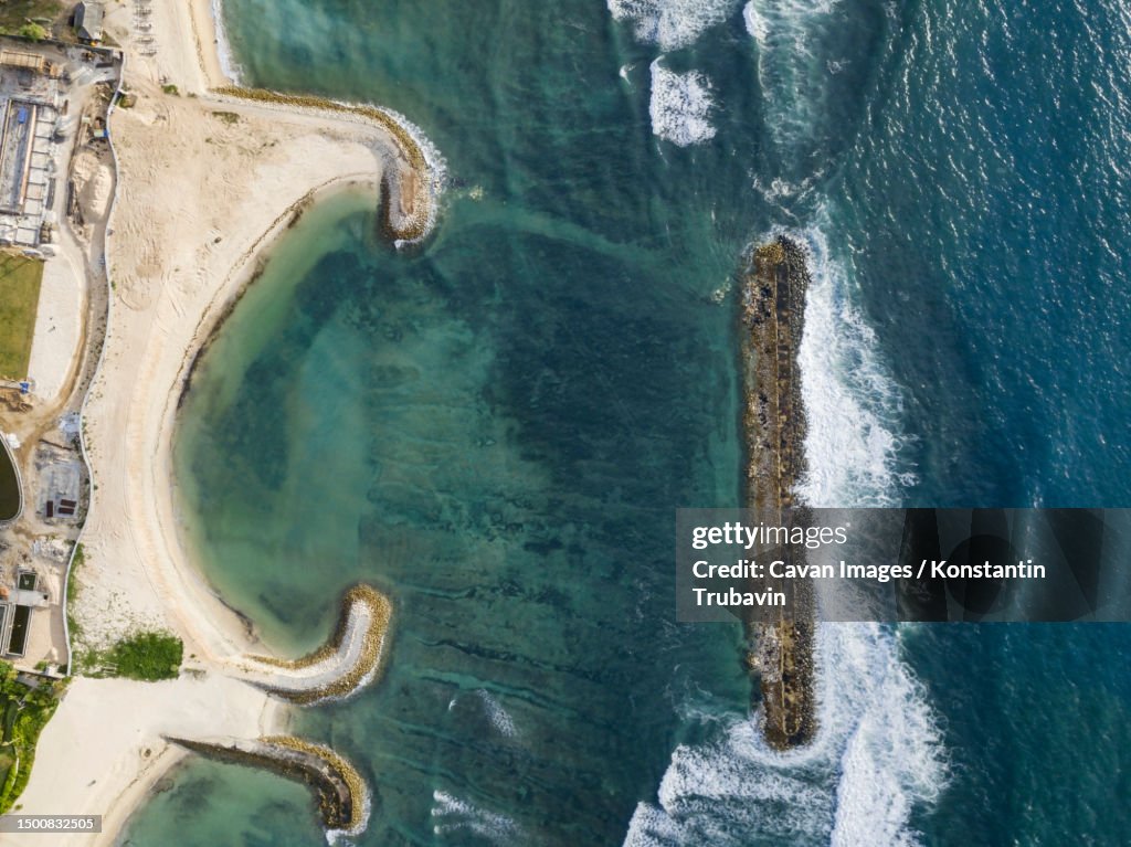 Aerial view of tropical beach and breakwaters, Nikko Beach, Bali, Indonesia