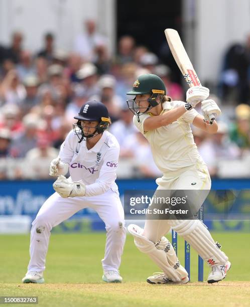 Australia batter Annabel Sutherland cuts a ball watched by Amy Jones during day two of the LV= Insurance Women's Ashes Test match between England and...