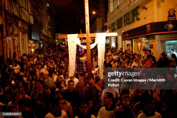 catholics celebrate holy week with a solemn procession through the streets of merida, venezuela - easter parade stock-fotos und bilder