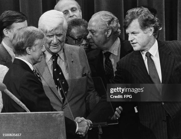 American politician Jimmy Carter, American politician Tip O'Neill, and American politician Ted Kennedy, who shakes hands with Carter after Carter had...