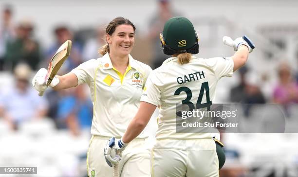 Australia batter Annabel Sutherland celebrates reaching her century with Kim Garth during day two of the LV= Insurance Women's Ashes Test match...